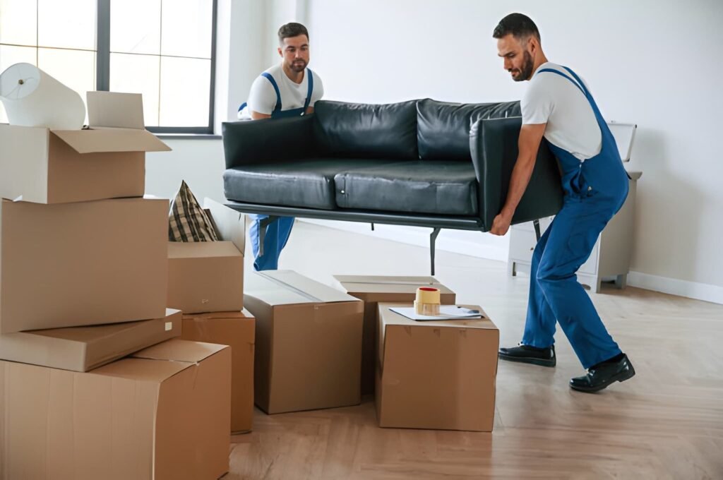 Professional movers carrying a sofa during a local move